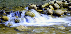 River moving forward over rocks and obstacles, river flowing
