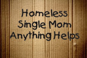 Cardboard sign, “Homeless. Single Mom. Anything helps”
