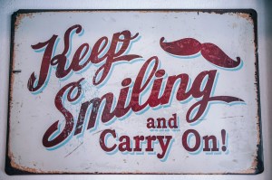 Sign “Keep Smiling and Carry On”